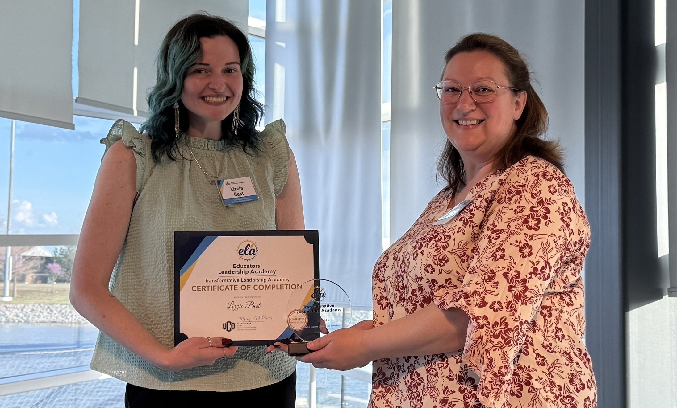 Lizzie Best receiving a certificate